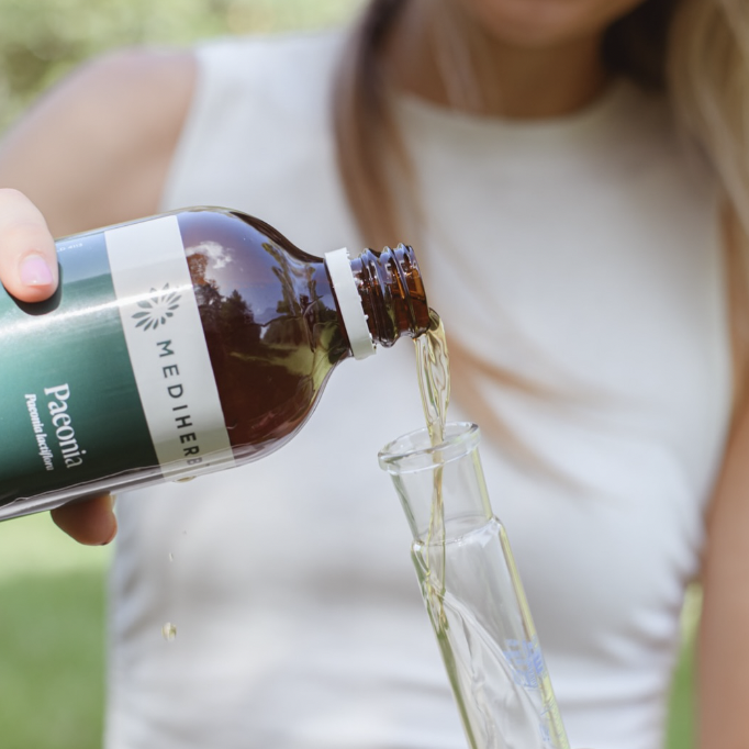 Amy Angus pouring MediHerb liquid herbal tincture